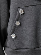 SUDADERA BOTONES FLOR